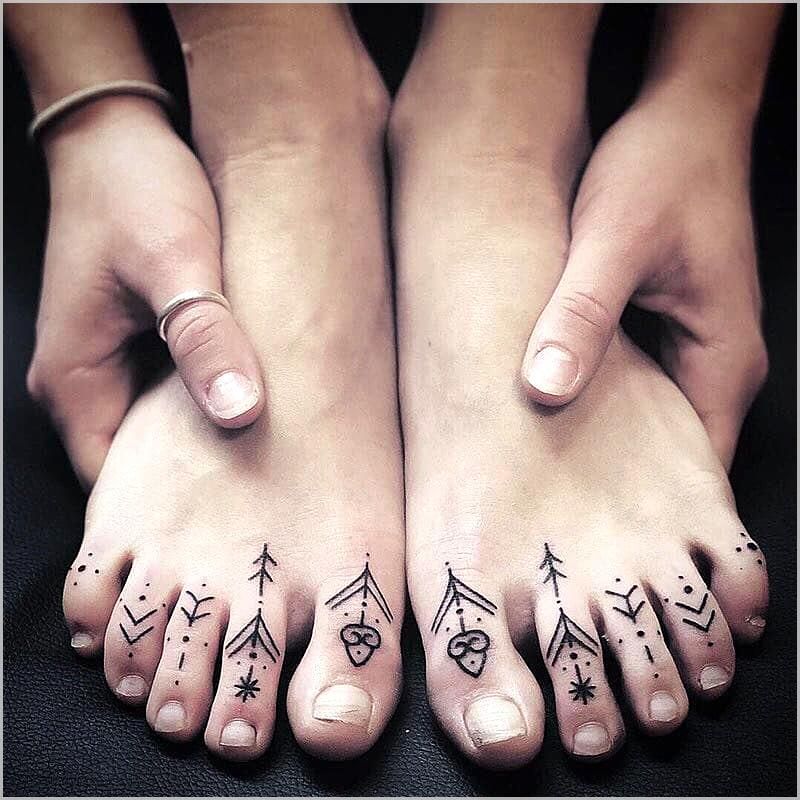 Symbolic Toes Tattoos